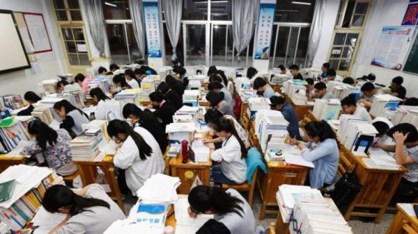 This photo taken on May 24, 2016 shows senior high school students studying at night to prepare for the college entrance exams at a high school in Lianyungang